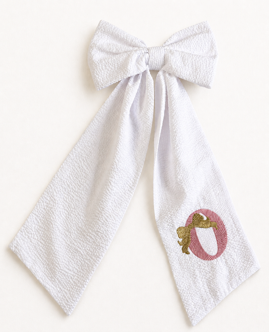 Golden Bows Metallic bow sash flat lay showing shimmering embroidered detail