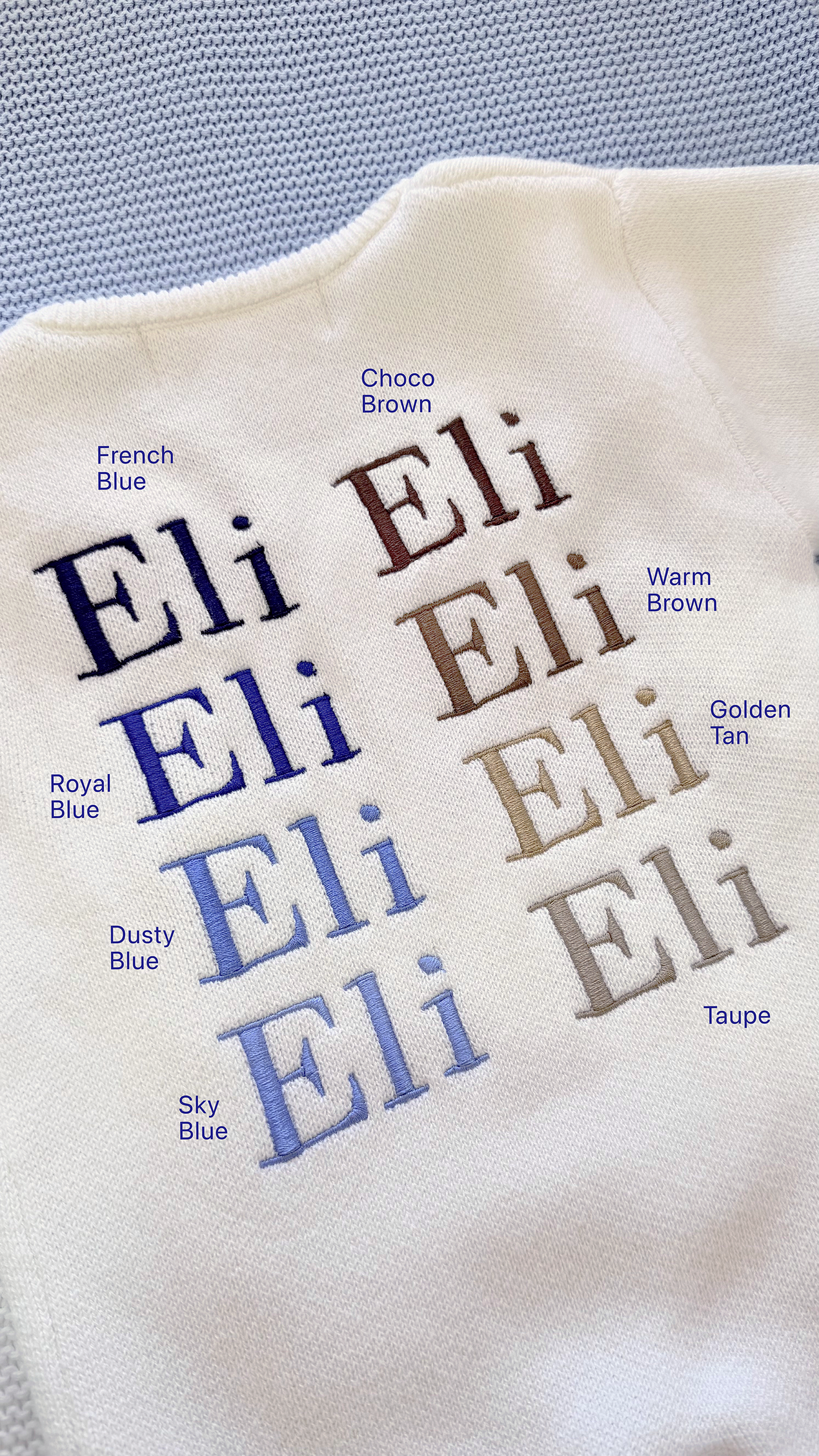 Blue embroidery thread color options displayed on Warm White knit fabric using the sample name Eli.