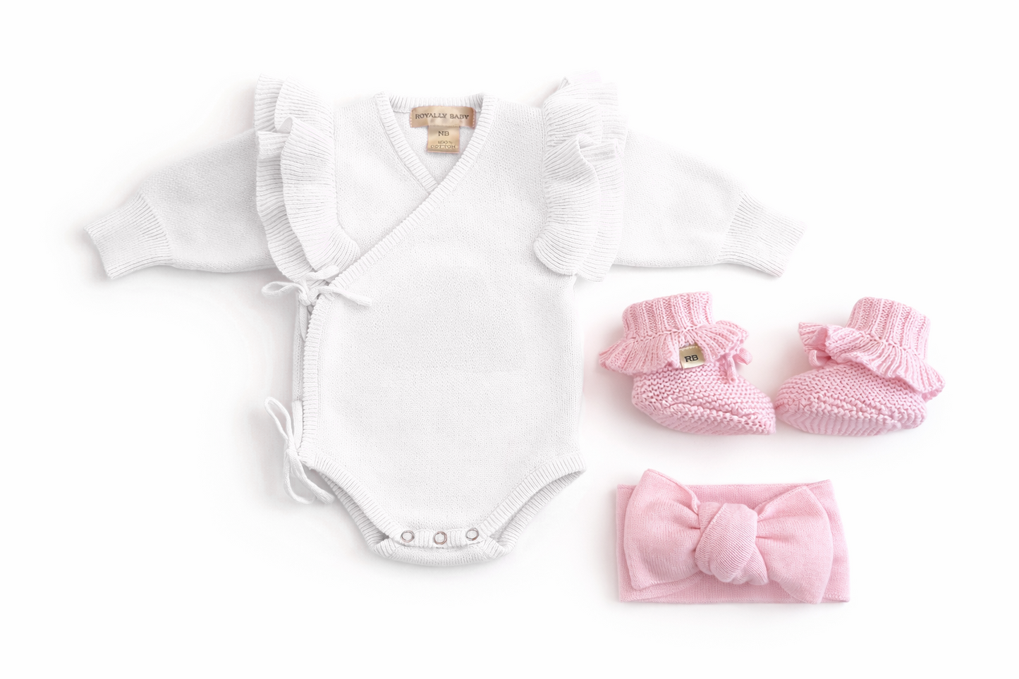 Warm white wrap romper set with petal pink bow and booties, personalized embroidery shown