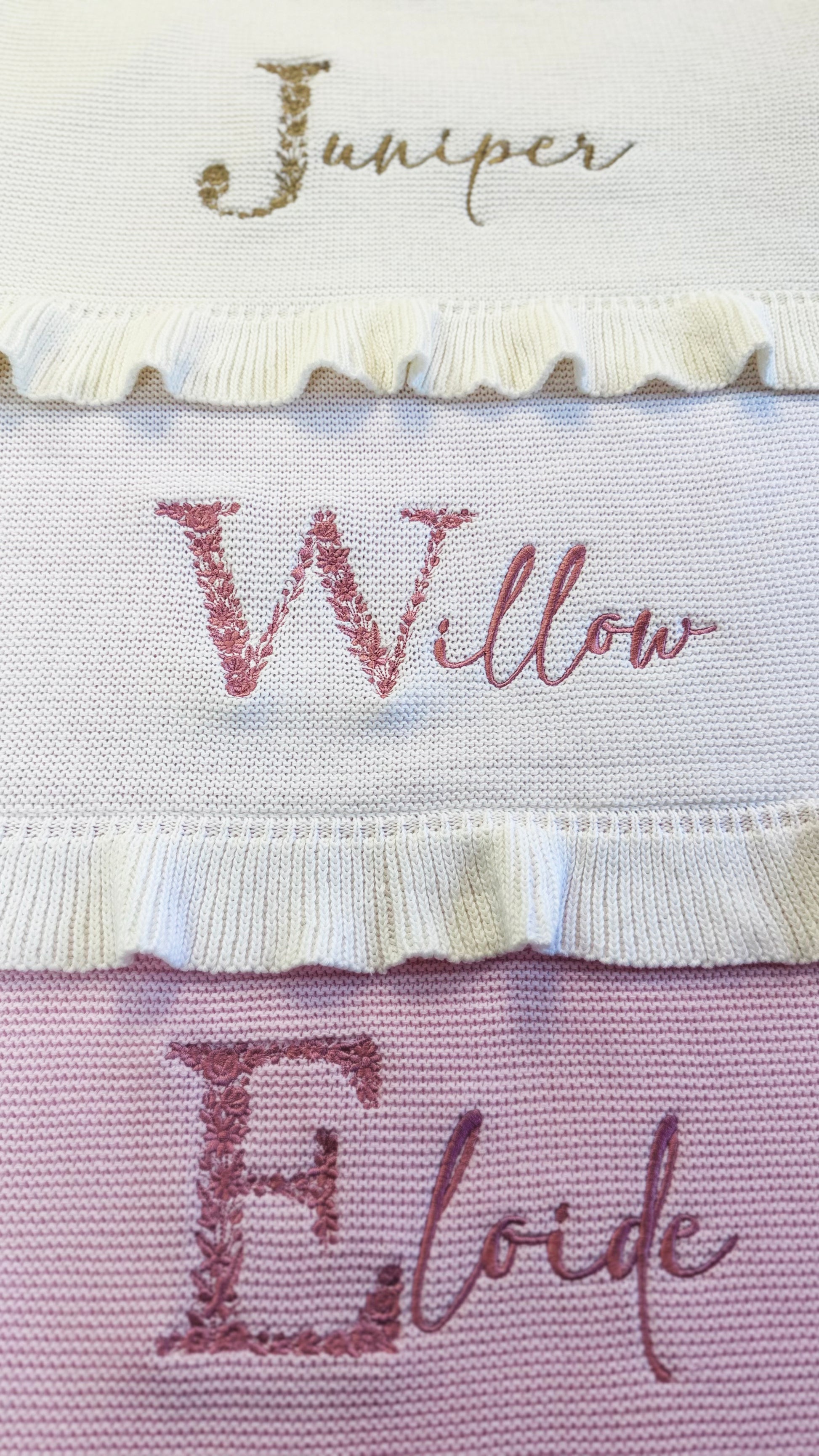 Personalized floral initial baby blanket with embroidered name and soft ruffled trim in knit cotton