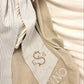 Personalized baby blanket with embroidered name styled with ribbon detail in soft khaki knit