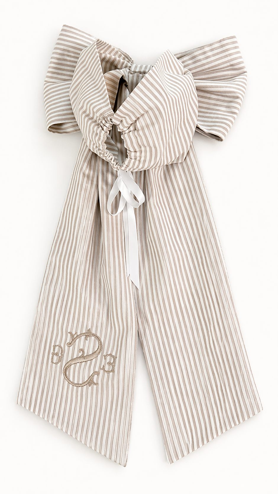 Back view of personalized newborn name sash with oversized bow, neutral striped cotton fabric, adjustable tie closure and embroidered monogram, baby hospital announcement sash keepsake