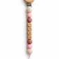 Personalized pacifier clip with the name Luna, soft pink and neutral beads, and wooden bear clasp, a secure and meaningful everyday baby essential