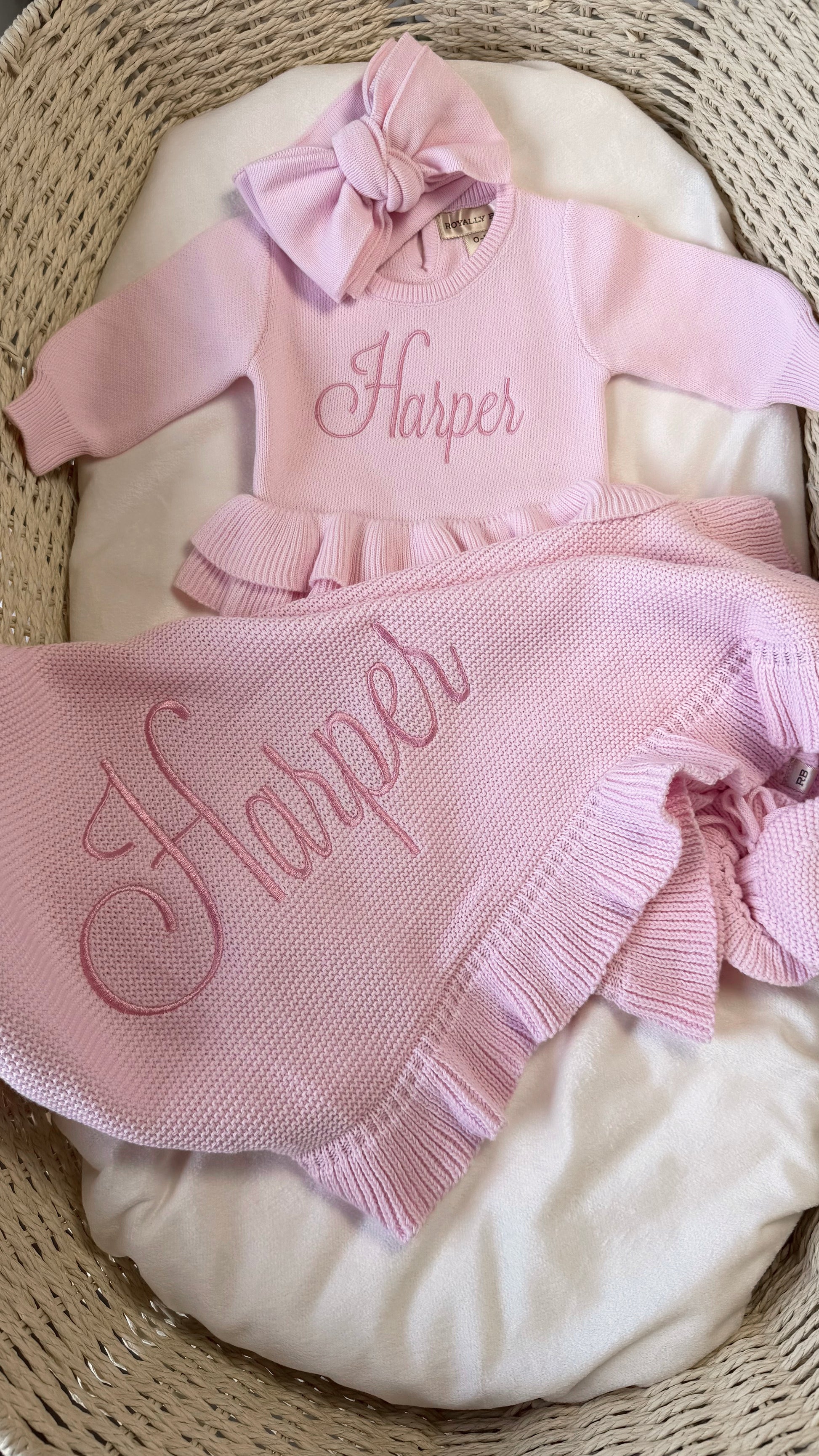 Petal pink Ballerina long romper set displayed with matching bow, ruffle booties and personalized ruffle blanket.