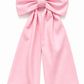 Personalized newborn bow sash detail showing embroidered monogram and fabric texture