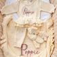 Personalized Buttercream Yellow Ballerina long romper set with matching bow, ruffle booties, and knit blanket