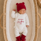 Newborn boy in a Warm White Kimono Christmas romper with bear-ear hat and matching booties