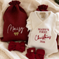 Personalized Christmas gift sack embroidered with a name and finished with a golden bow