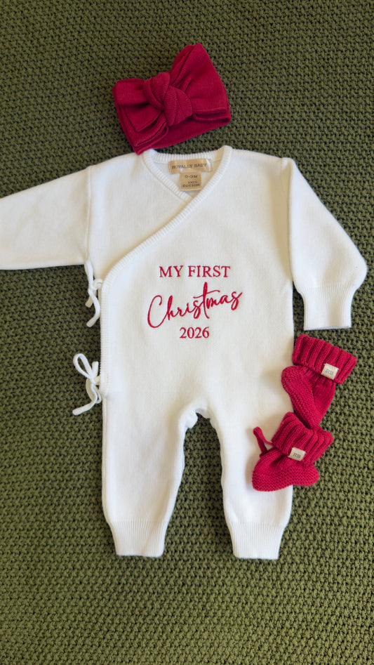 Newborn girl in a Warm White Kimono Christmas romper with matching bow and booties