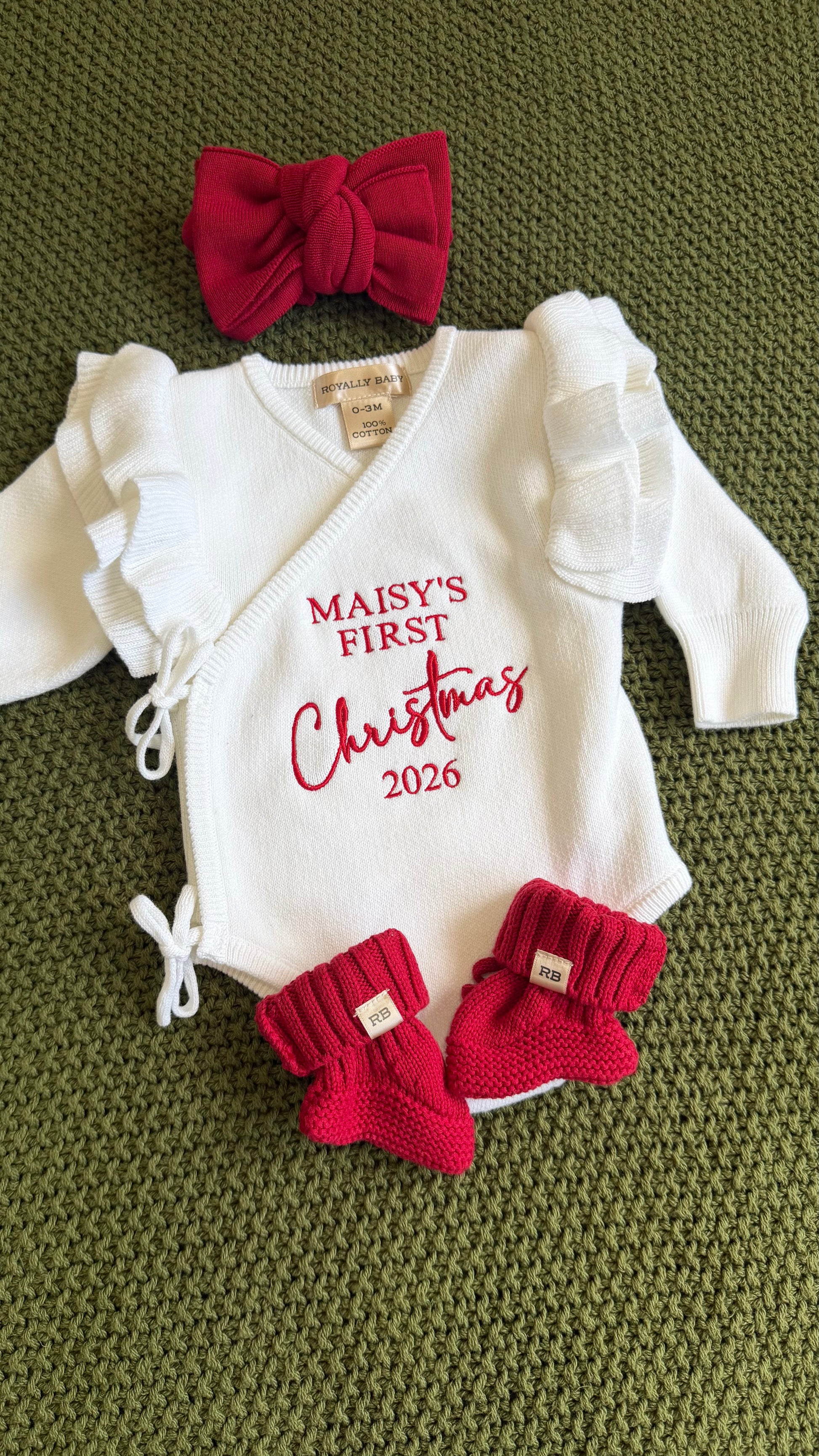 Personalized Christmas romper set flat lay with matching accessories