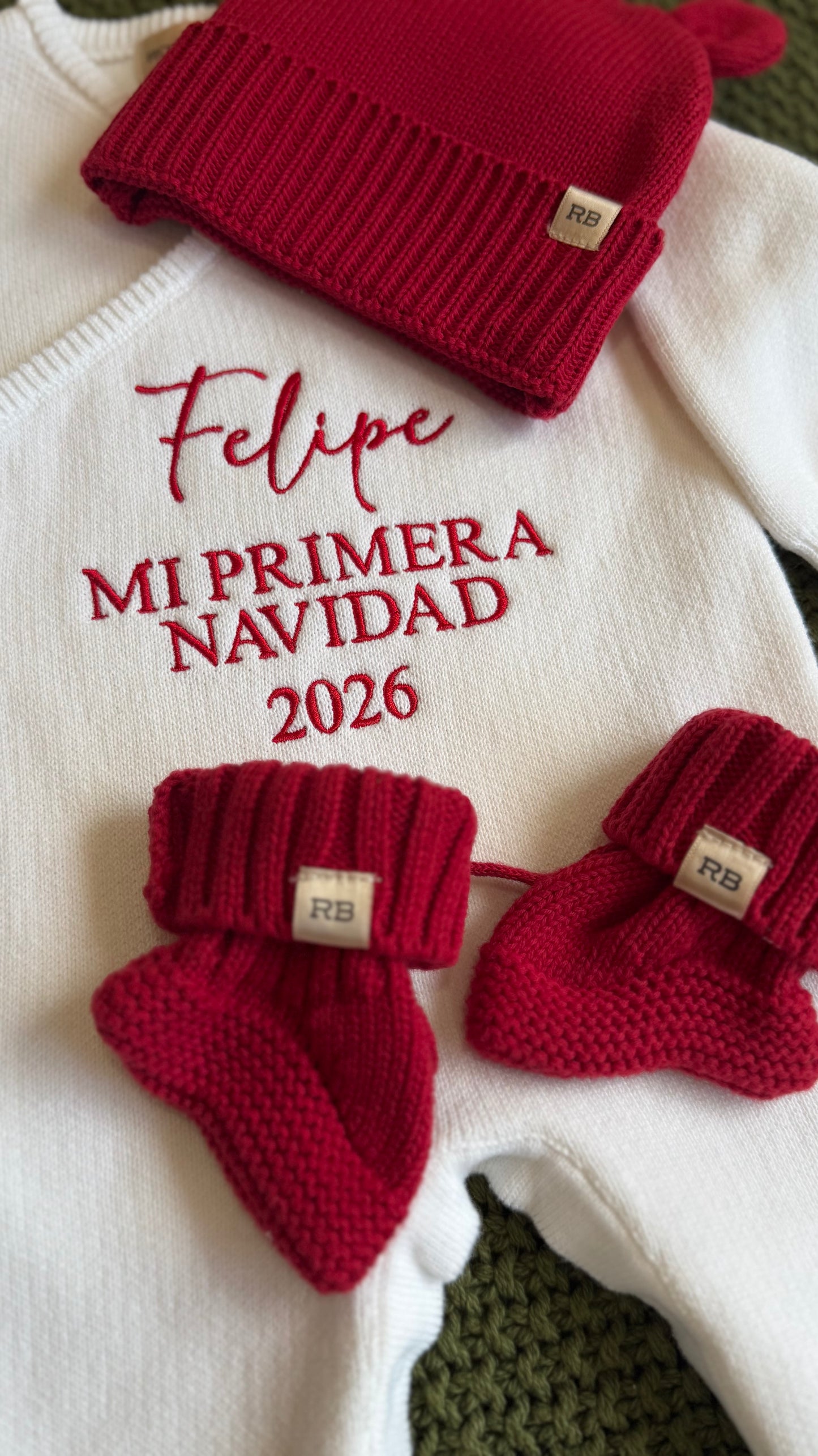 Close-up of personalized name embroidery on a Christmas romper