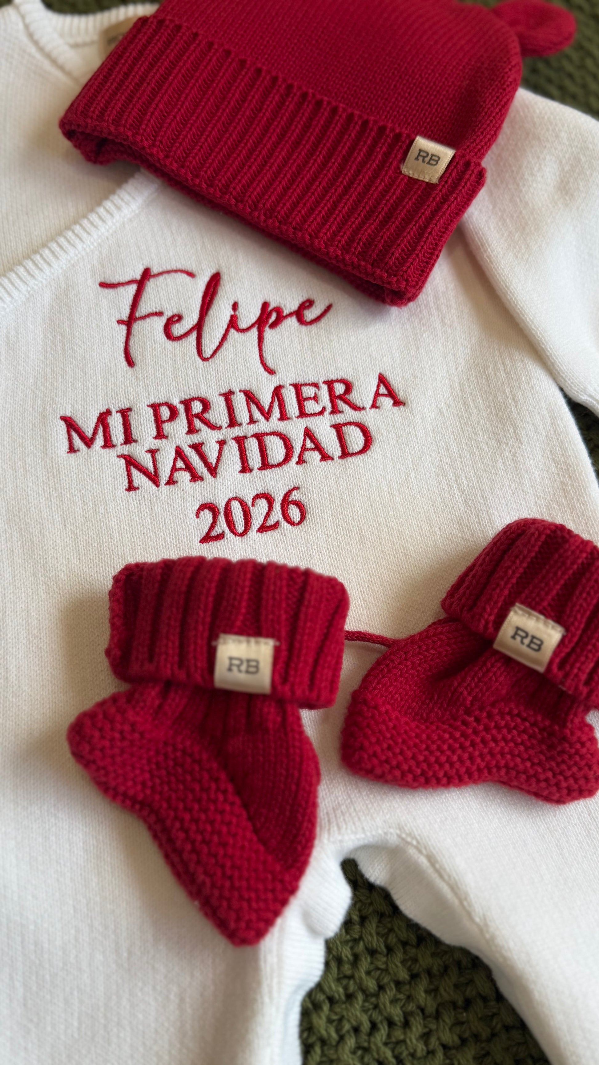 Close-up of personalized name embroidery on a Christmas romper