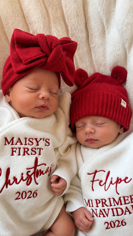 Sleeping newborns in red Christmas knitwear with personalized name embroidery