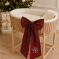 Plaid tartan bow sash styled on a moses basket for a newborn Christmas photo