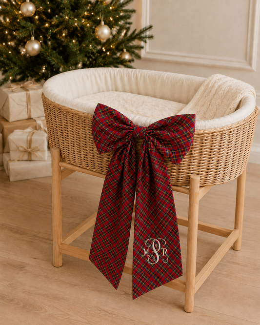 Plaid tartan bow sash styled on a moses basket for a newborn Christmas photo