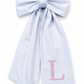 Close-up of floral initial embroidery on a personalized newborn bow sash