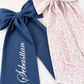 Full Name Newborn bow sash flat lay showing fabric and embroidered name detail