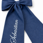 Newborn wearing the Full Name bow sash, styled for hospital coming home photos