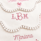 Baby girl bib trio styled flat lay showing all three designs