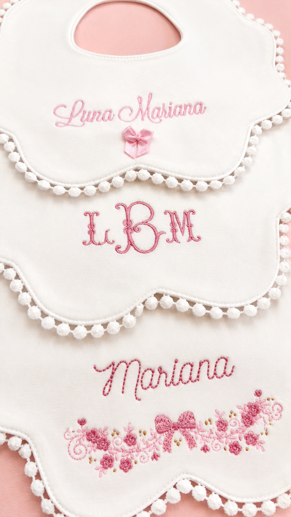 Baby girl bib trio styled flat lay showing all three designs