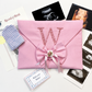 Personalized baby keepsake envelope, side angle showing fabric trim