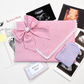 Close-up of personalized embroidery thread detail on keepsake envelope