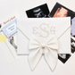 First Moments Keepsake Envelope shown open with hospital bracelet and first photo
