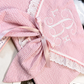 Close-up of embroidered monogram detail on First Moments Keepsake Envelope