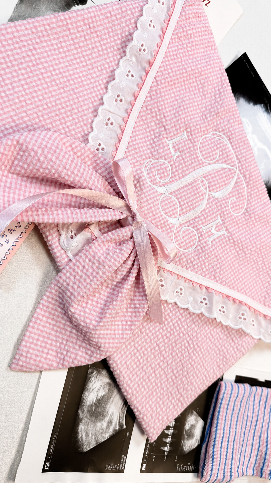 Close-up of embroidered monogram detail on First Moments Keepsake Envelope