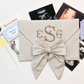 First Moments Keepsake Envelope styled with hospital bracelet and ultrasound photo