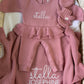 Personalized Dusty Mauve Ballerina long romper set displayed with matching oversized bow, ruffle booties and knit blanket.