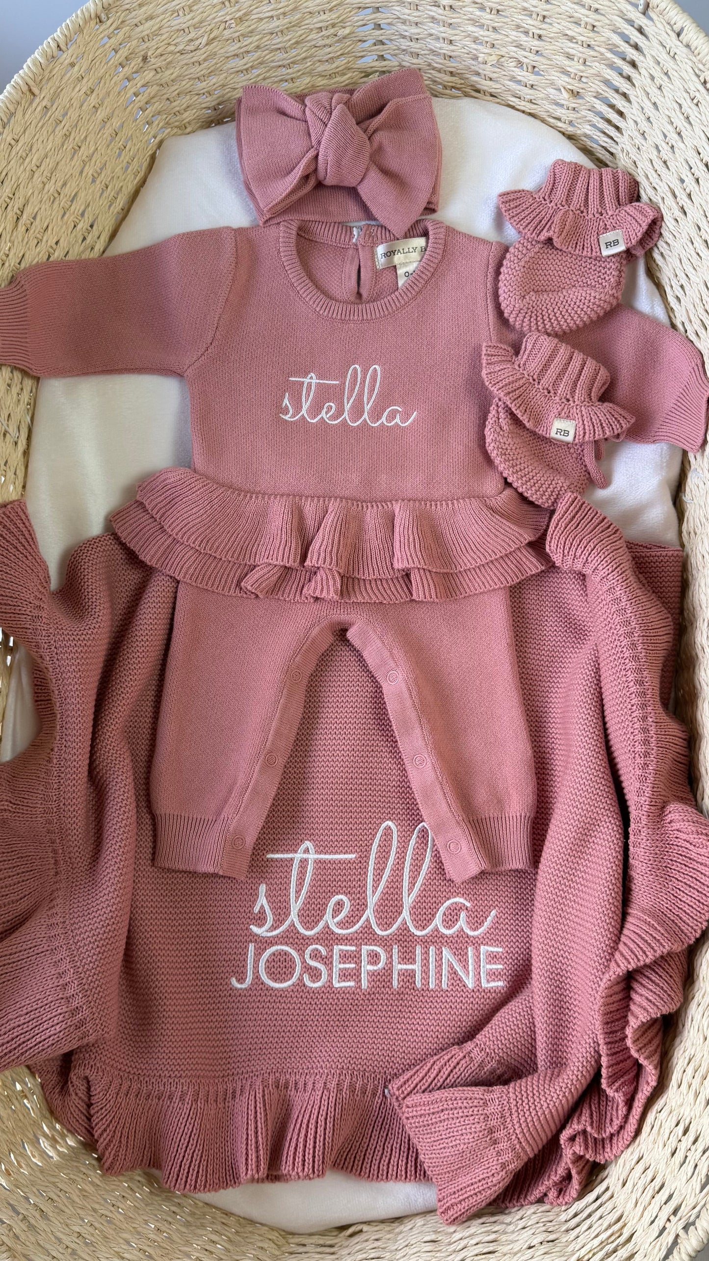 Personalized Dusty Mauve Ballerina long romper set displayed with matching oversized bow, ruffle booties and knit blanket.