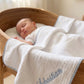 Close-up of embroidered name detail on Muslin Gingham Trim Blanket