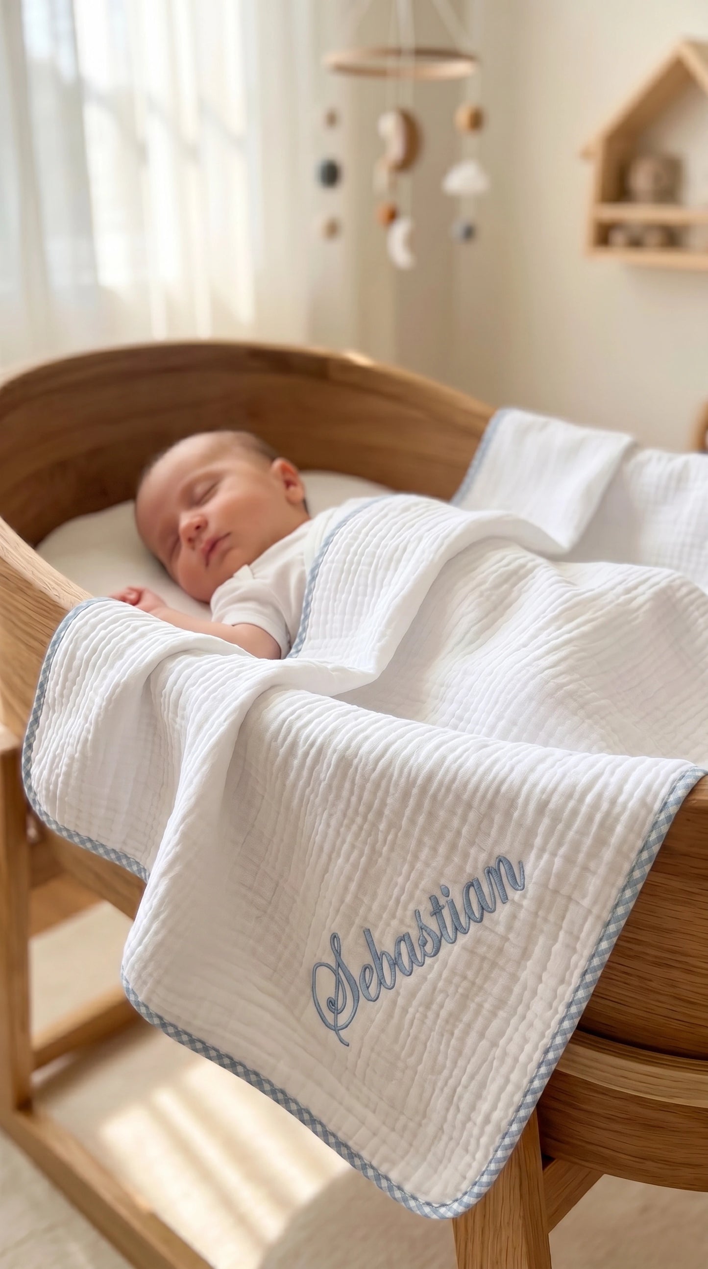 Close-up of embroidered name detail on Muslin Gingham Trim Blanket