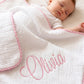 3-piece muslin lovey, burp cloth, and blanket set in pink gingham, flat lay