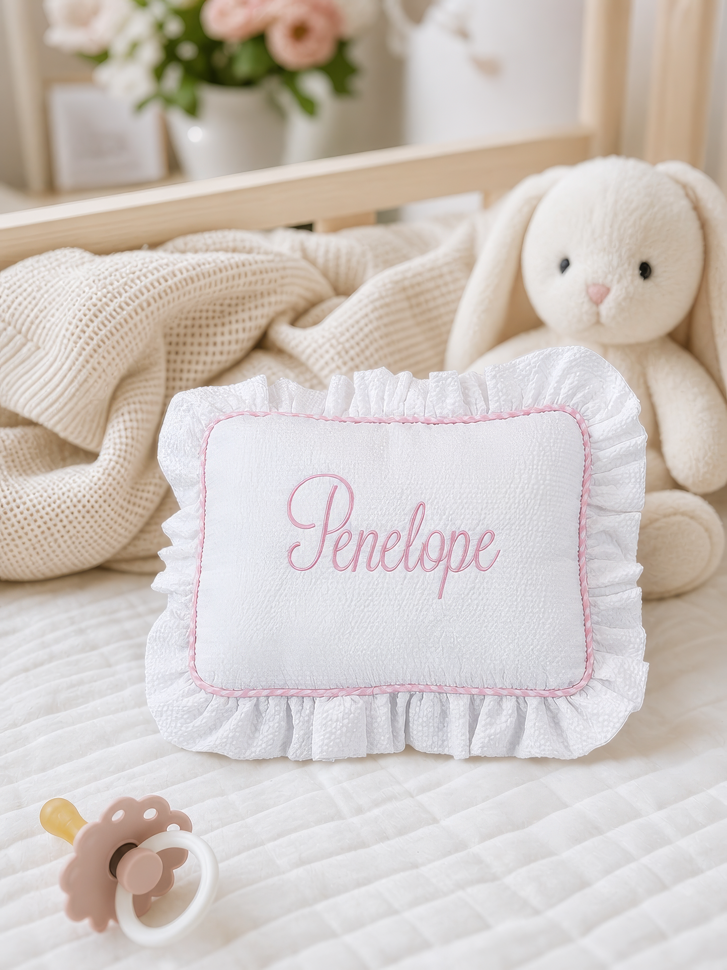 Close-up of embroidered name detail on keepsake pillow
