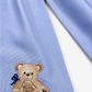 Close-up of Nursery Classics embroidery and monogram on a personalized newborn bow sash