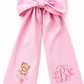 Personalized pink newborn bow sash with embroidered ballerina teddy bear and monogram detail for baby girl hospital coming home photos and newborn keepsake styling.