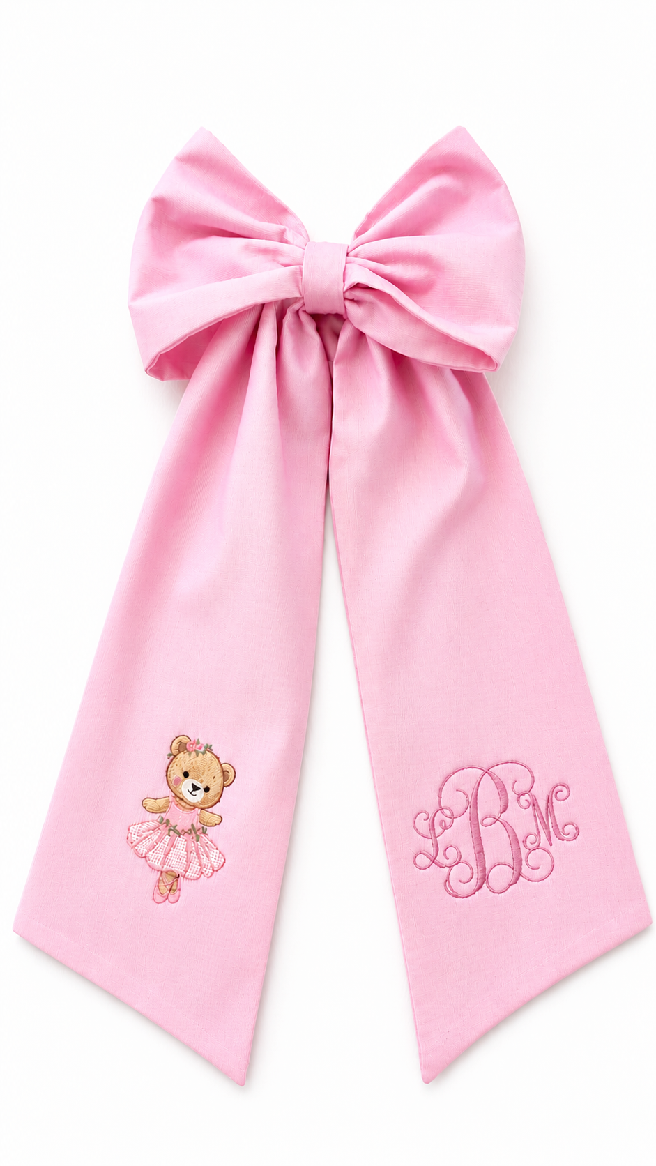 Personalized pink newborn bow sash with embroidered ballerina teddy bear and monogram detail for baby girl hospital coming home photos and newborn keepsake styling.