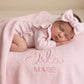 Newborn wearing personalized petal pink Butterfly romper with matching personalized blanket