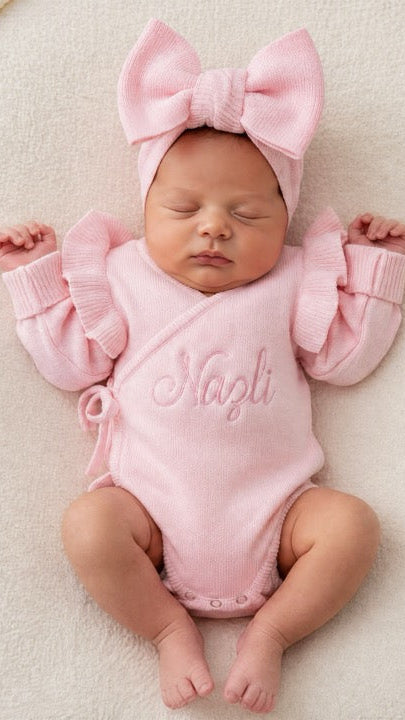 Detail view of personalized petal pink Butterfly romper for newborn coming home outfit