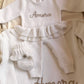 Warm White Ballerina long romper set with personalized romper, oversized bow, ruffle booties, and blanket.