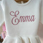 Newborn wearing personalized Warm White Ballerina romper, styled angle