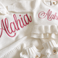 Detail view of personalized warm white Ballerina romper for newborn keepsake outfit
