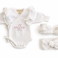 Warm white Butterfly romper set with matching bow and booties, personalized embroidery shown
