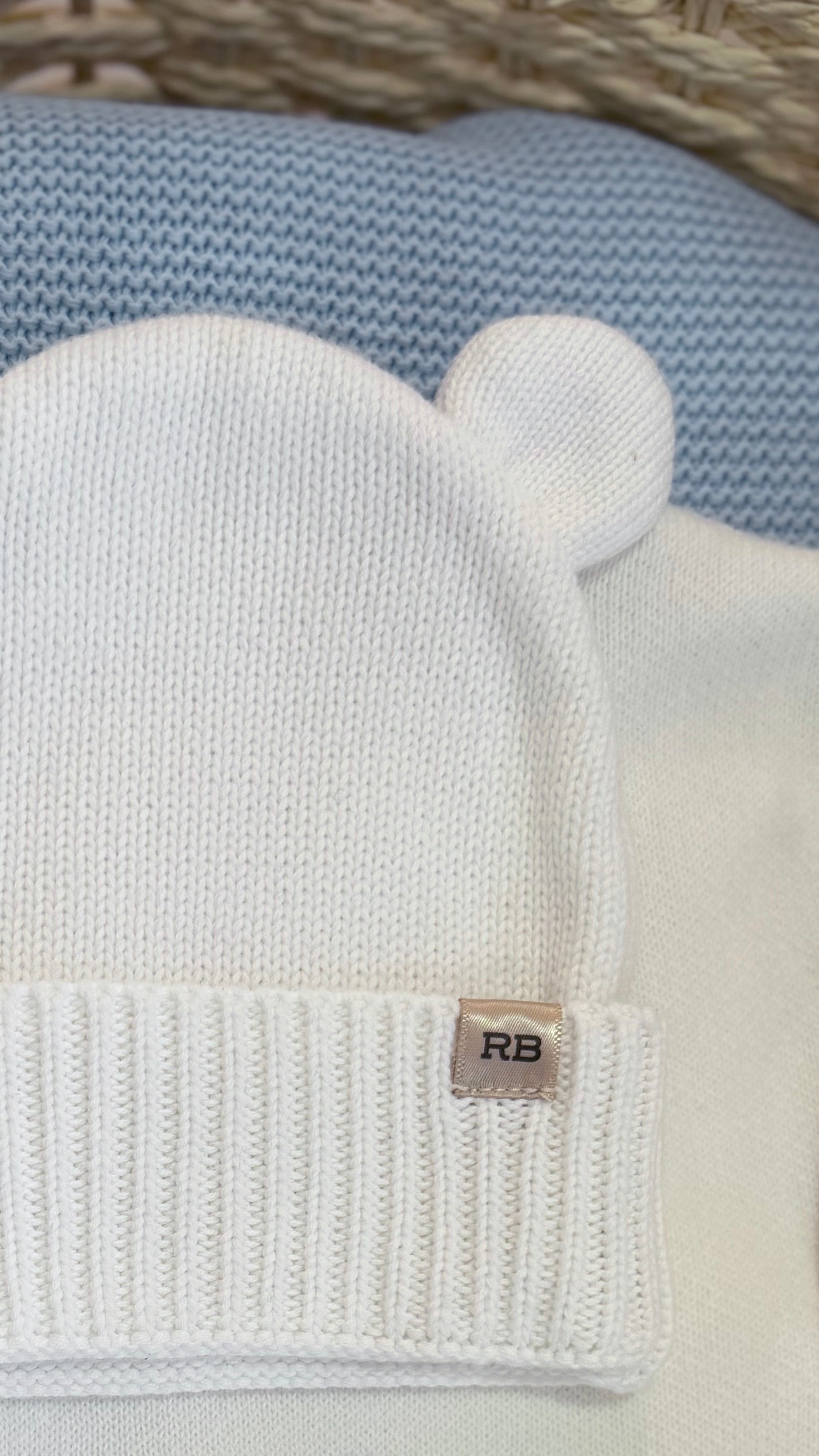 Close-up of the Warm White bear-ear knit hat included with the personalized newborn Kimono romper set