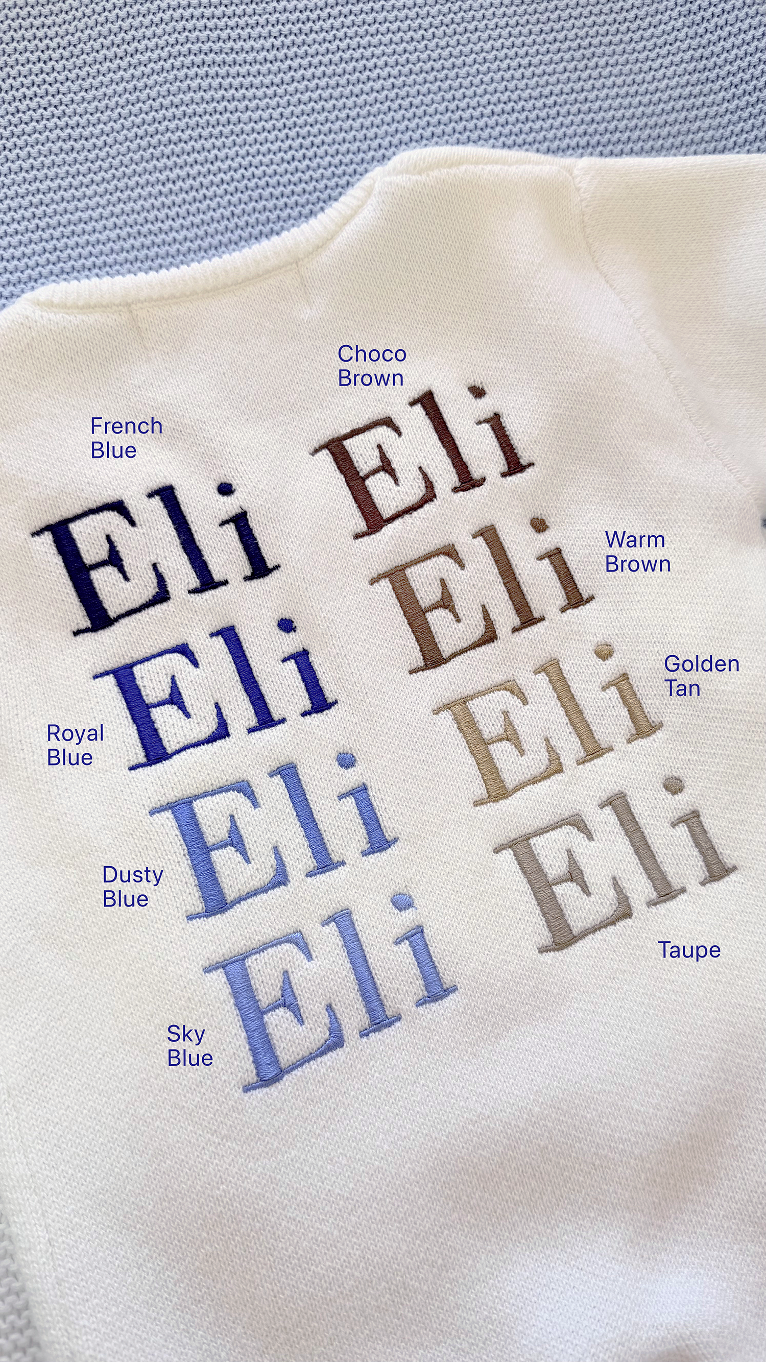 Blue embroidery thread color options displayed on Warm White knit fabric using the sample name Eli.