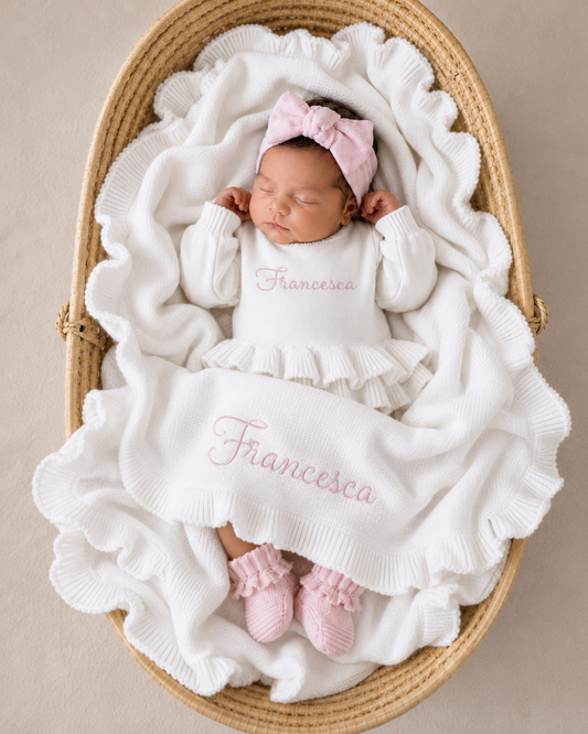Newborn wearing personalized white and pink Ballerina romper, short style, styled lifestyle shot