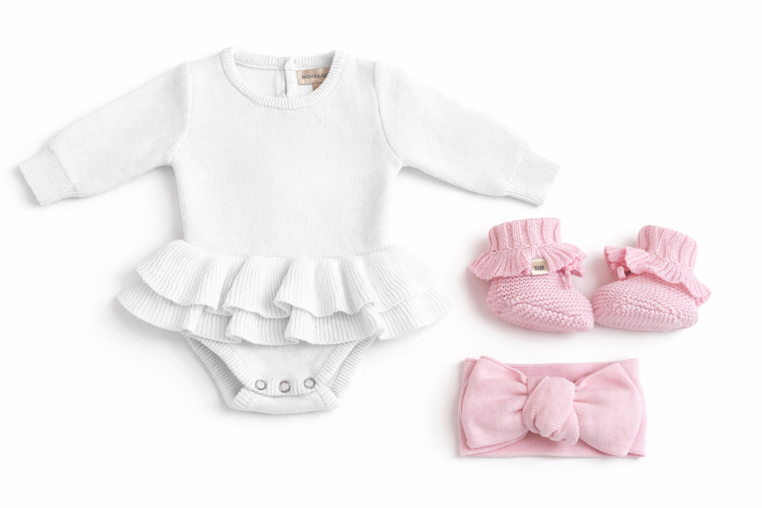 Newborn wearing personalized white Ballerina romper with petal pink bow and booties