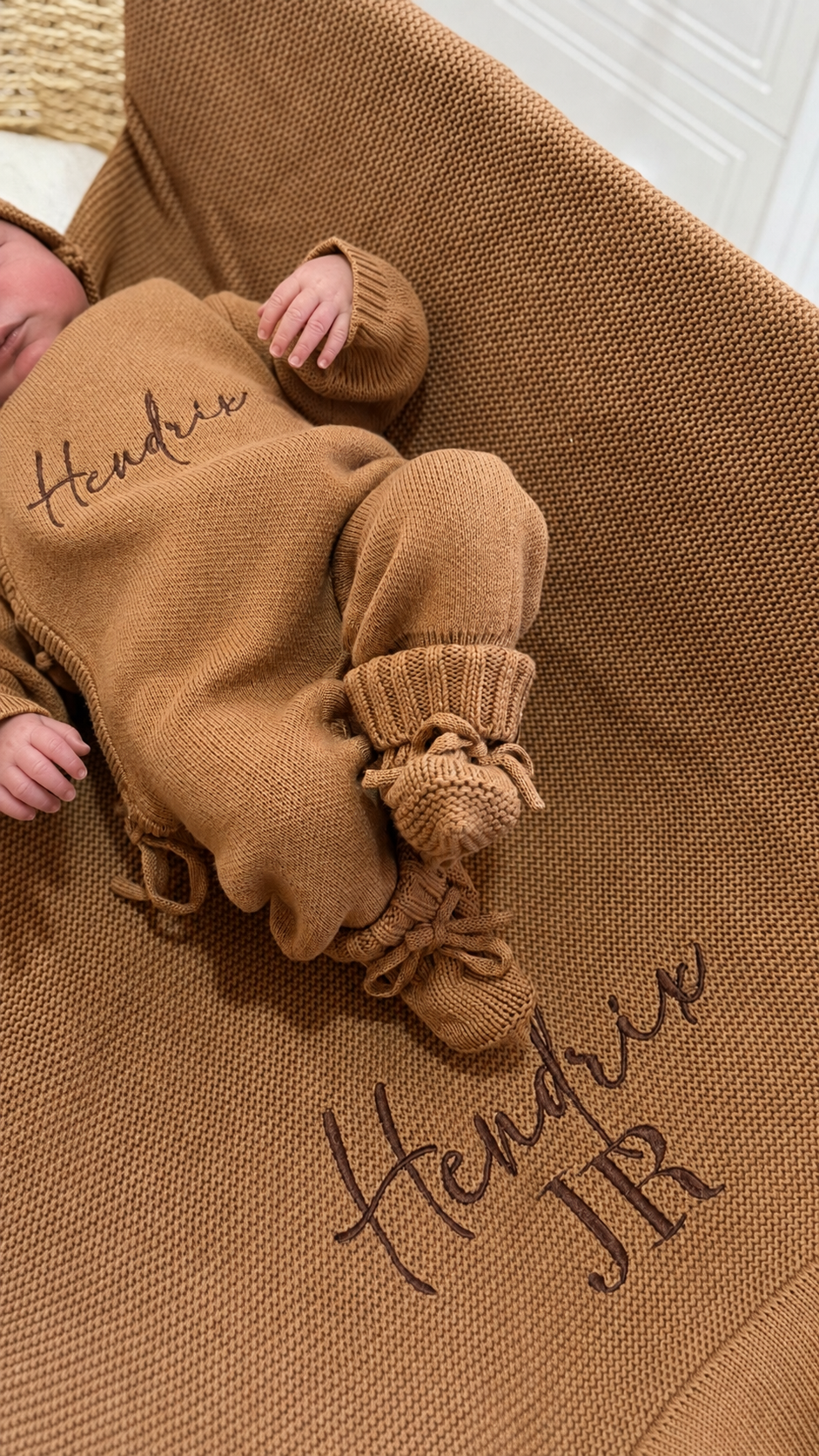 Baby wearing the Teddy Brown personalized kimono romper, bear-ear hat, and knit booties